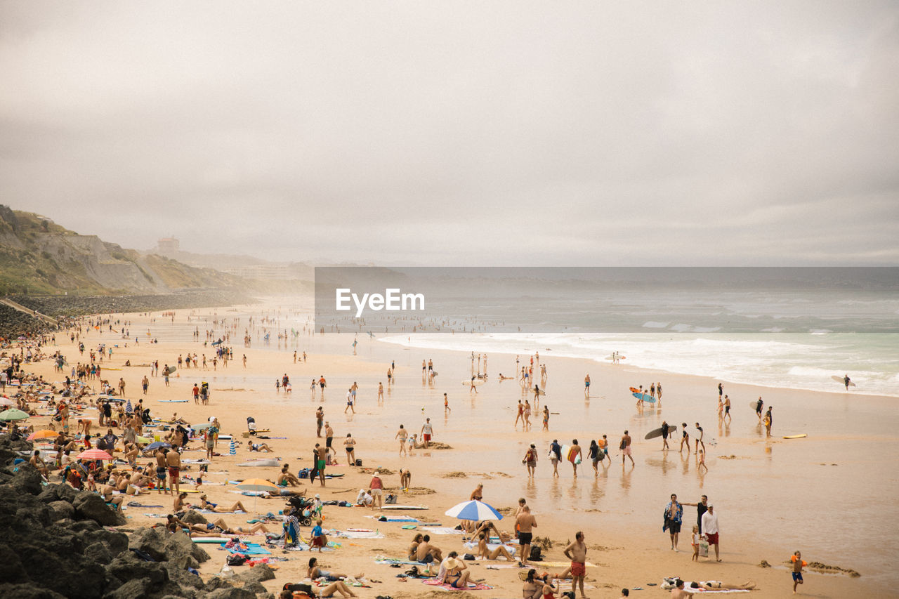 Overlooking the crowded beach in biarritz, france