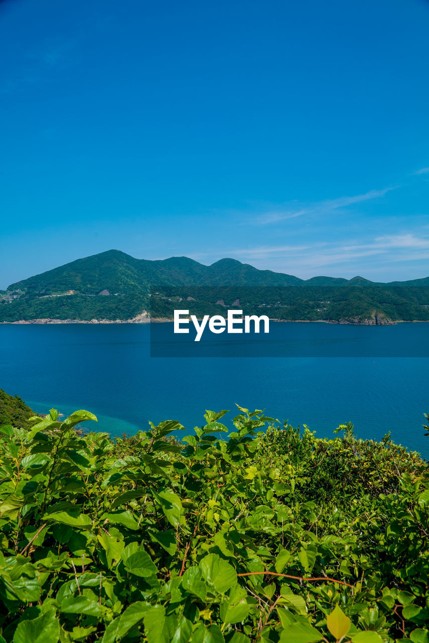 SCENIC VIEW OF BAY AGAINST SKY