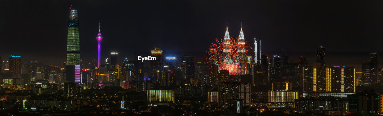 Illuminated buildings in city at night