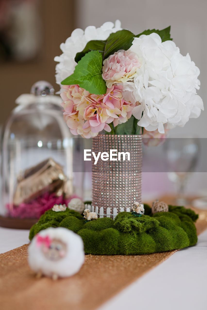 Close-up of roses in vase on table