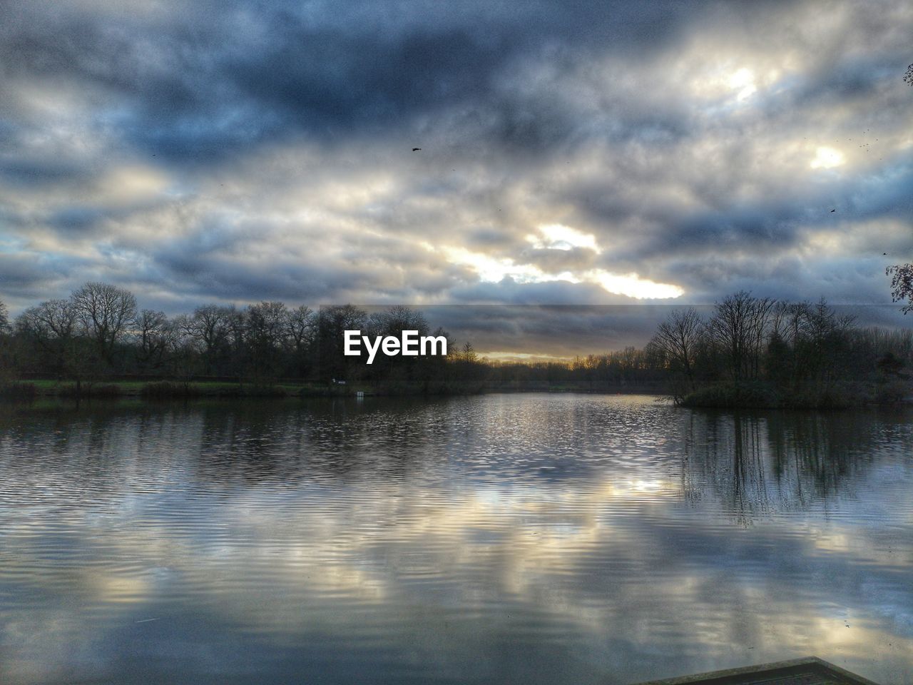 SCENIC VIEW OF LAKE BY TREES AGAINST SKY