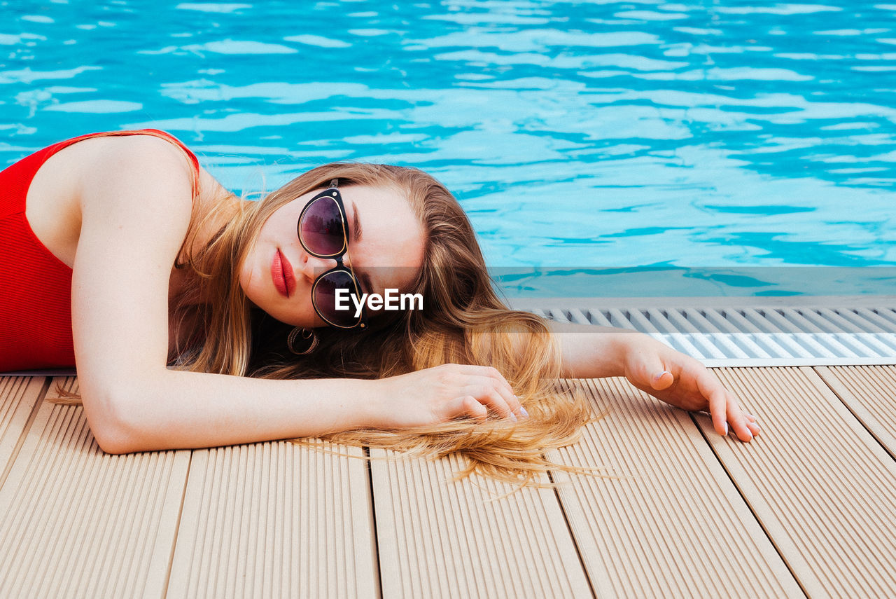 Woman relaxing in swimming pool