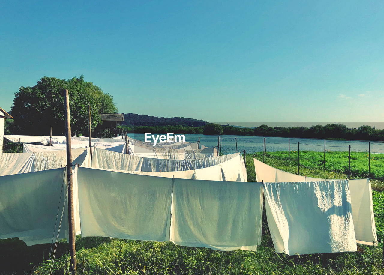 PANORAMIC VIEW OF LAKE AGAINST CLEAR SKY