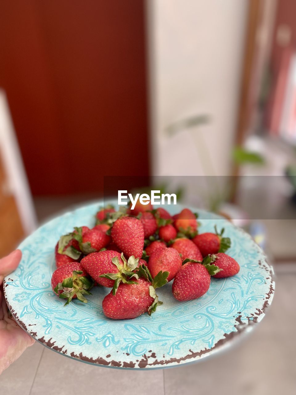 Close-up of strawberries in plate on table