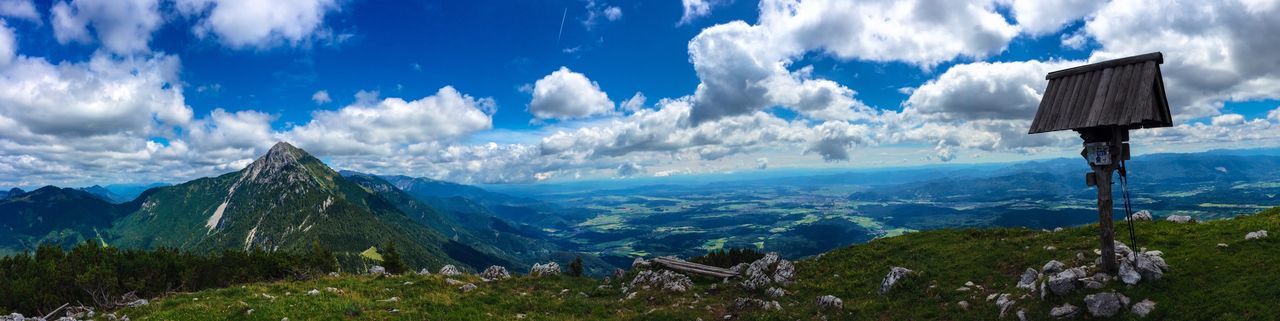 Panoramic view of land and mountains against sky