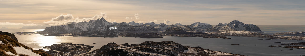 sky, water, scenics - nature, cloud, environment, landscape, beauty in nature, mountain, sea, nature, travel destinations, cold temperature, snow, rock, travel, winter, land, panoramic, sunset, ice, reflection, beach, tourism, coast, mountain range, no people, tranquility, outdoors, tranquil scene, mountain peak, sun, horizon