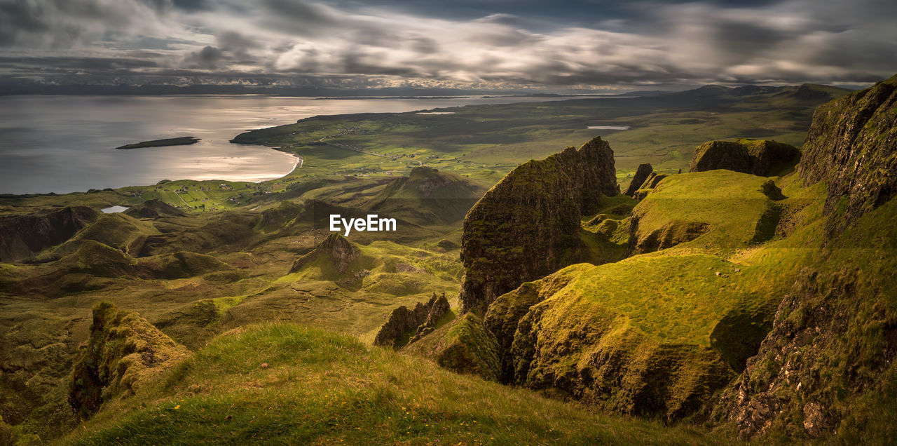 SCENIC VIEW OF SEA AND MOUNTAIN AGAINST SKY