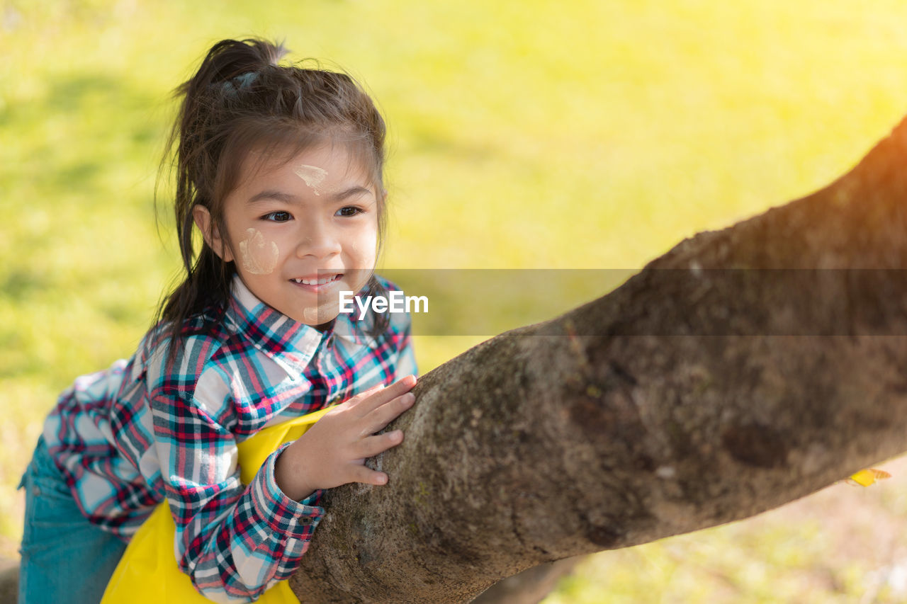 Girl climbing tree