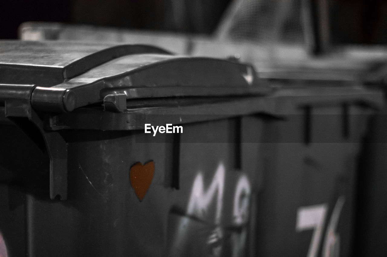 Close-up of heart shape on garbage bin
