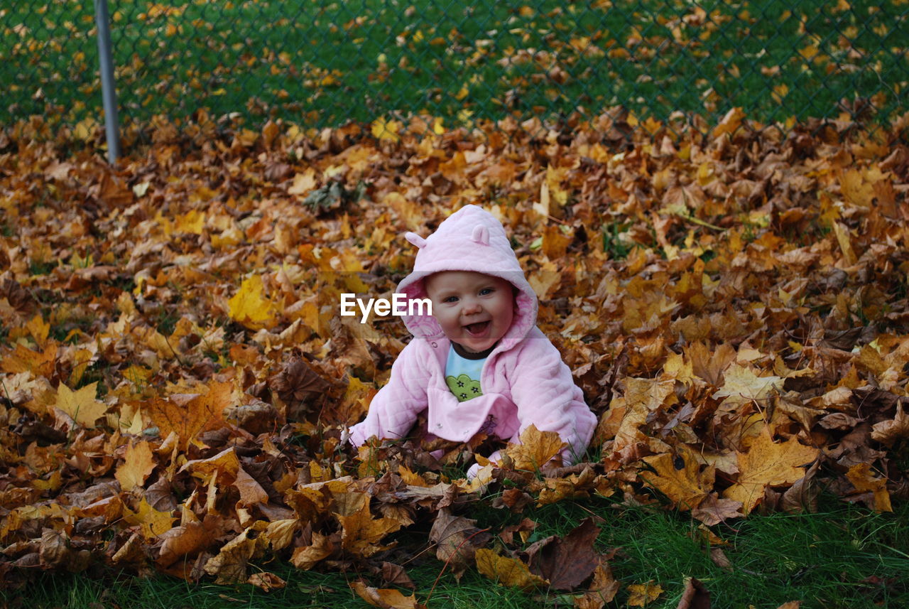 Baby girl discovers leaves