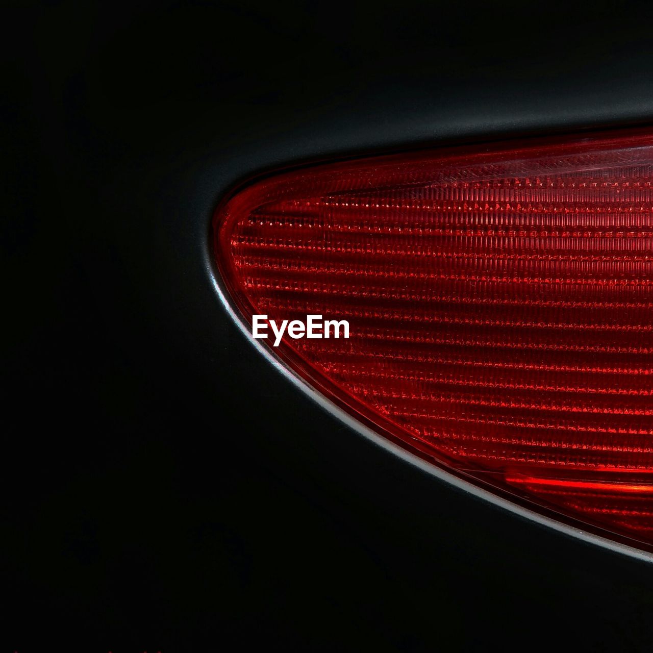 Close-up of illuminated red car taillight