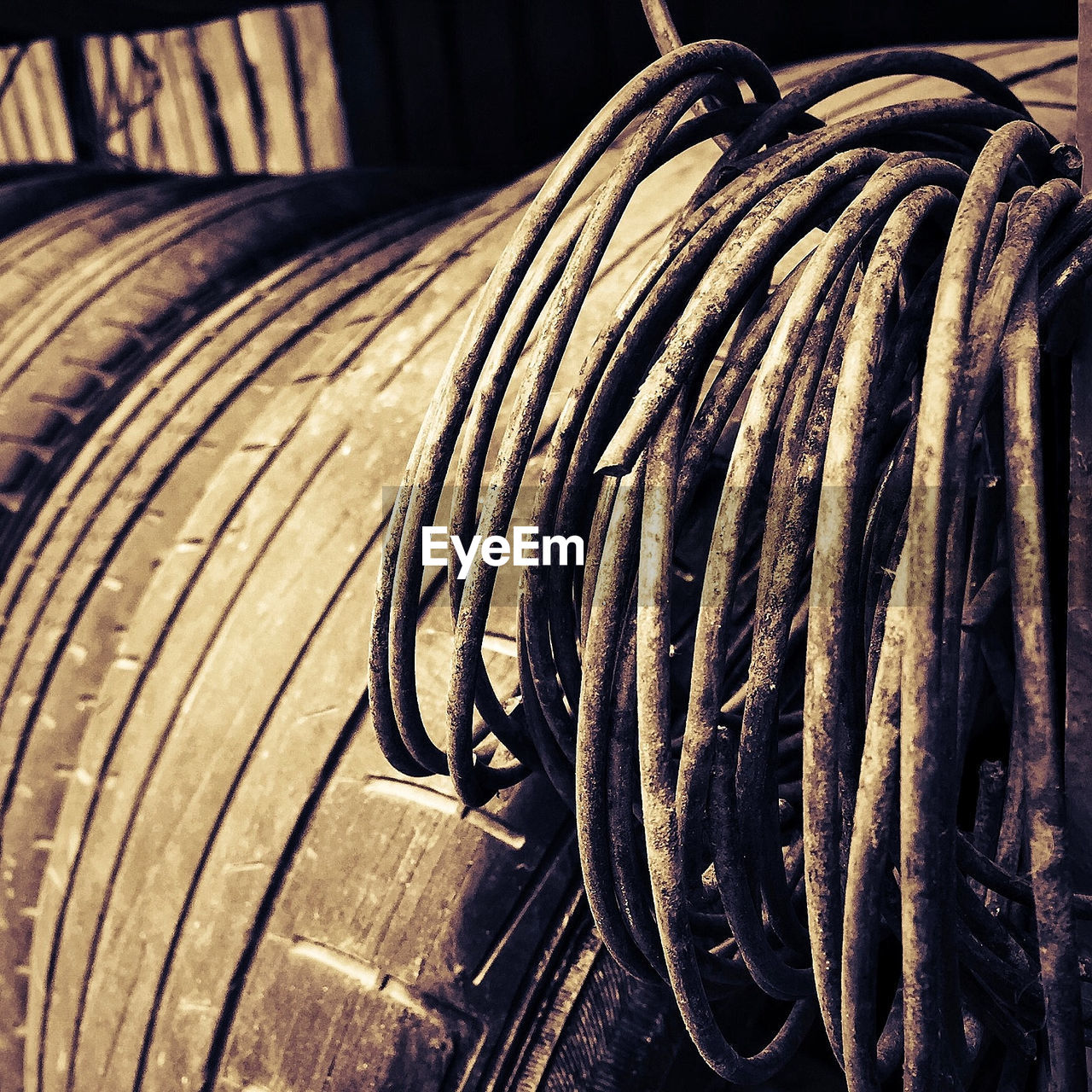 Close-up of damaged steel cables on tires in factory