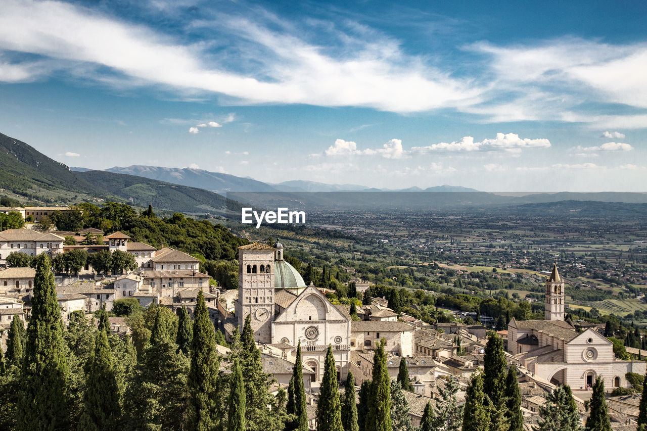 High angle view of town against cloudy sky