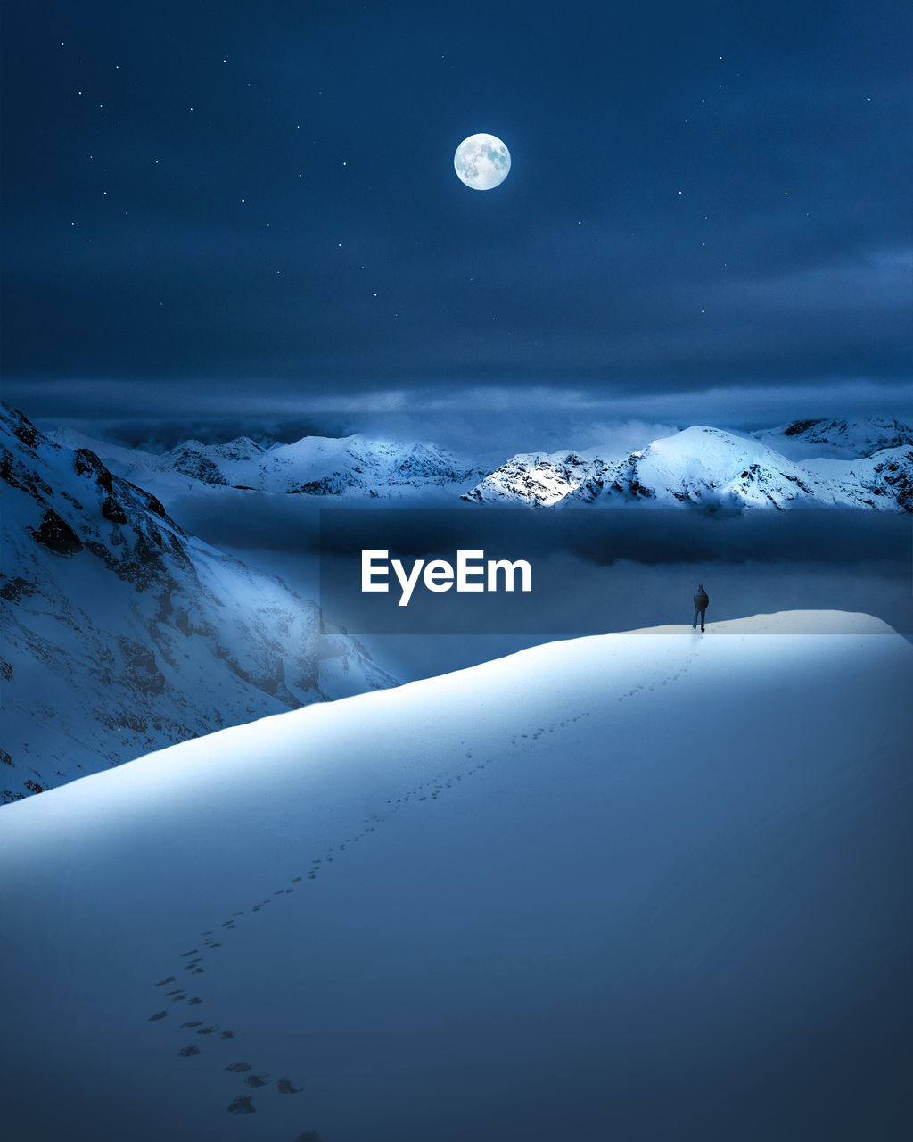 Scenic view of snowcapped landscape against sky at night