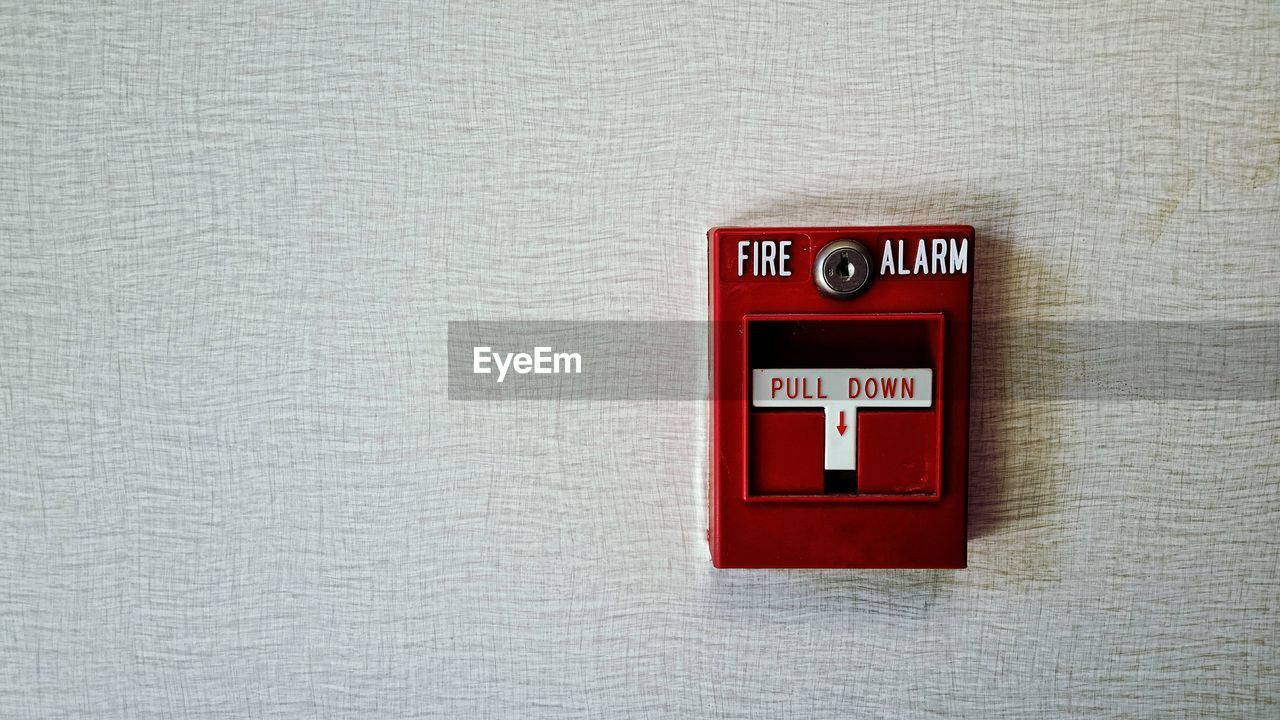 Fire alarm on an interior wall