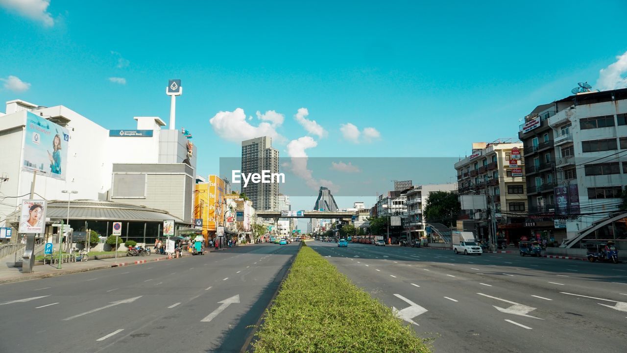 CITY STREET AGAINST SKY