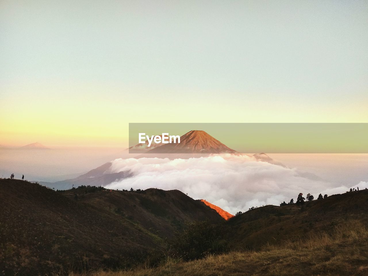 VIEW OF VOLCANIC MOUNTAIN AGAINST SKY DURING SUNSET
