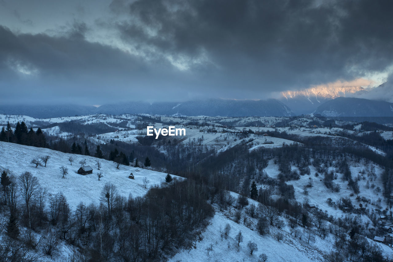 Scenic view of snow covered landscape against sky