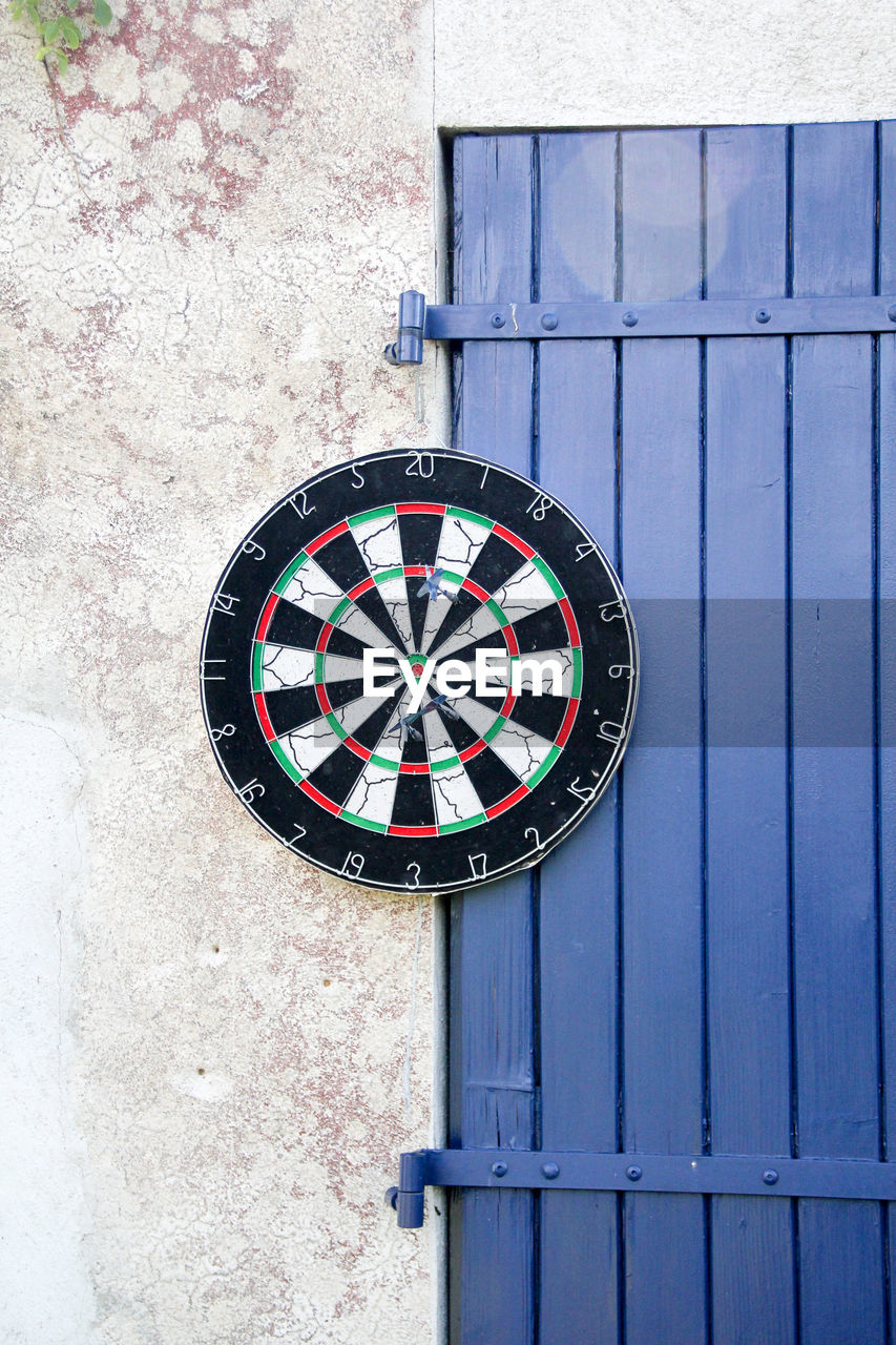 Close-up of dartboard hanging on wall