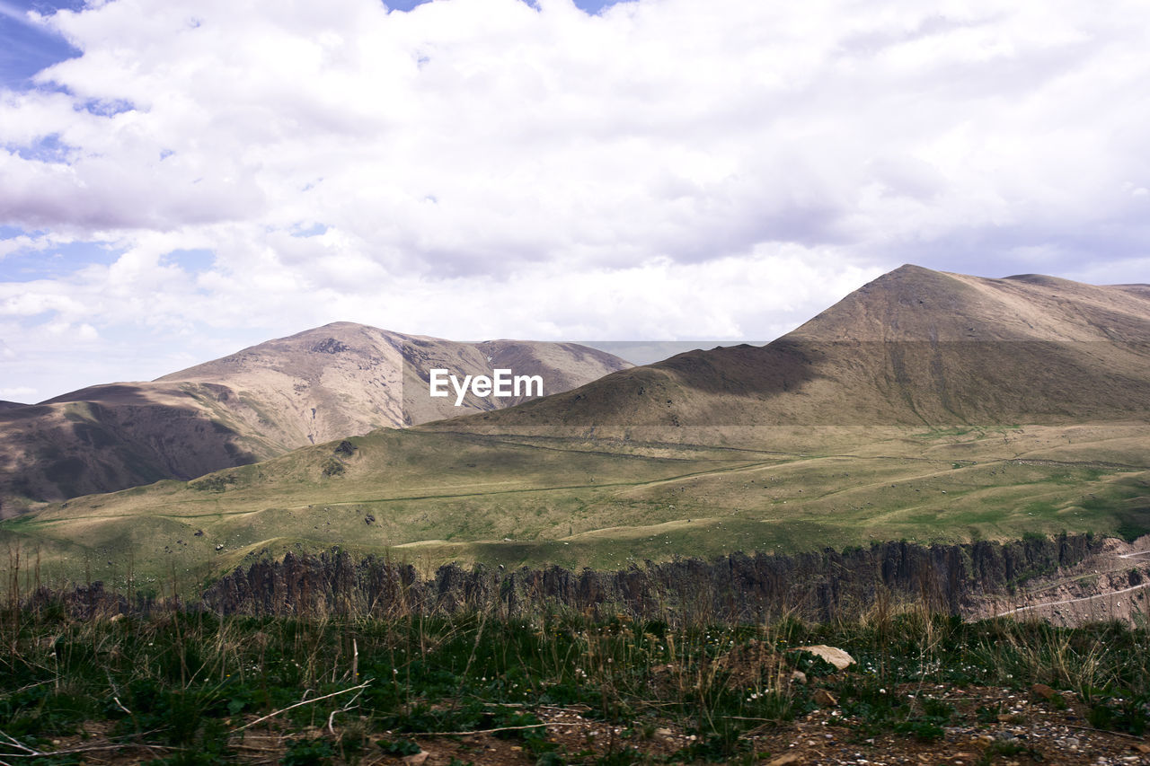 SCENIC VIEW OF MOUNTAIN AGAINST SKY