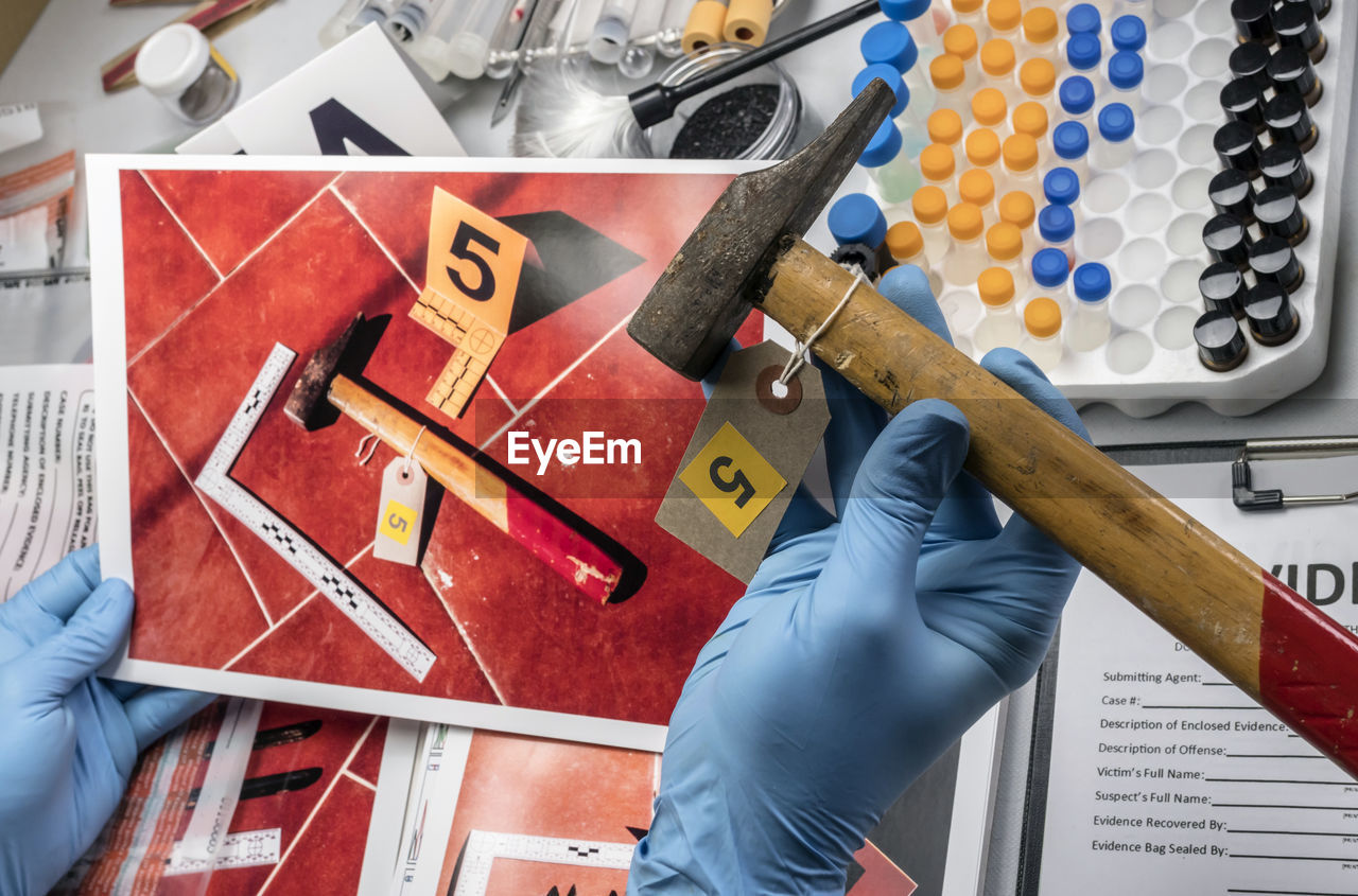 HIGH ANGLE VIEW OF MAN WORKING IN WORKSHOP