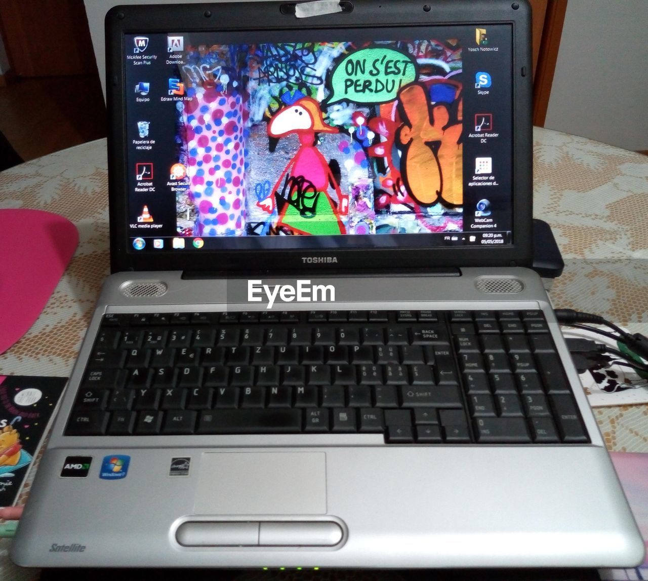 LOW ANGLE VIEW OF LAPTOP ON TABLE AT HOME