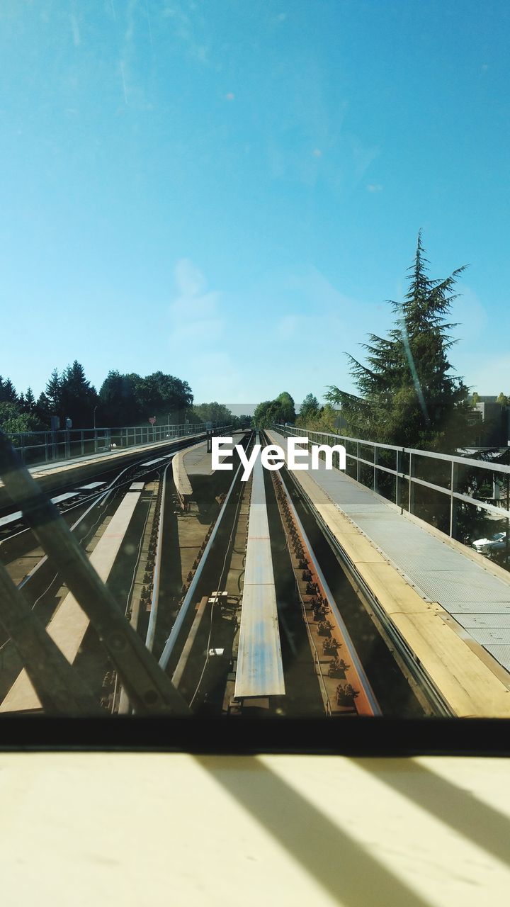 RAILROAD TRACKS AGAINST SKY