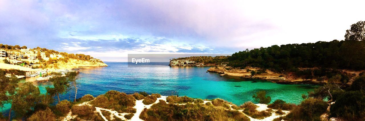 Scenic view of bay against sky