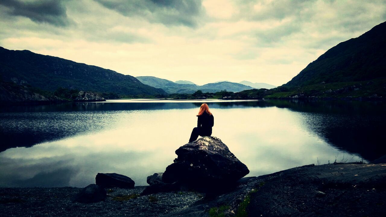 SCENIC VIEW OF LAKE WITH MOUNTAINS IN BACKGROUND