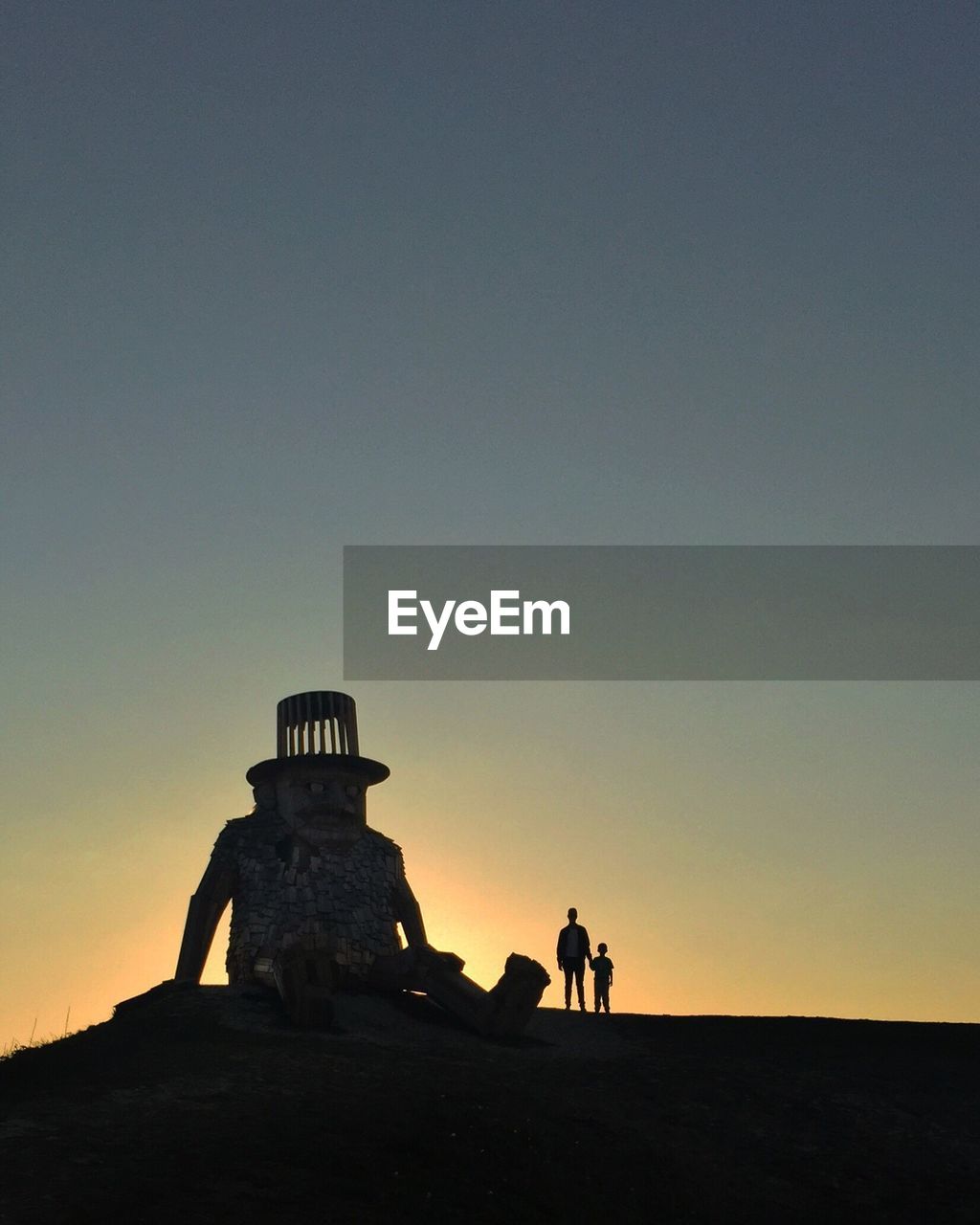 TOURISTS AT SUNSET