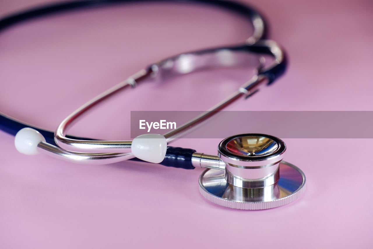 Stethoscope on pink background