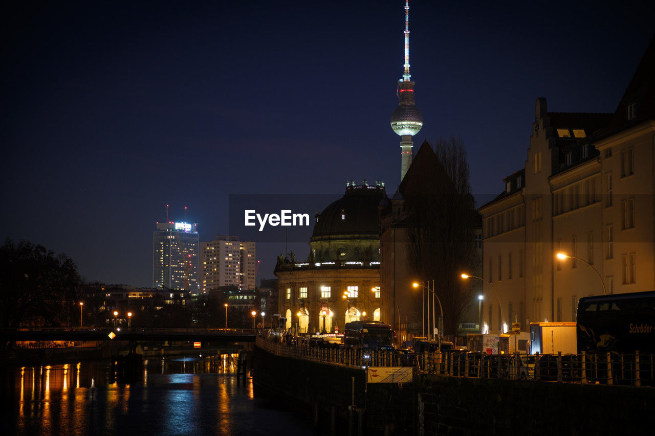 architecture, built structure, building exterior, night, illuminated, city, evening, travel destinations, building, cityscape, dusk, landmark, sky, reflection, water, tower, travel, nature, tourism, skyline, no people, downtown, river, urban skyline, landscape, city life, bridge, office building exterior, outdoors, skyscraper, light, darkness