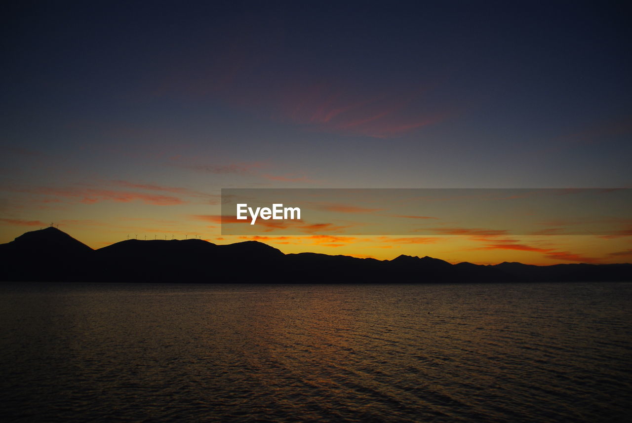 Scenic view of sea against sky during sunset