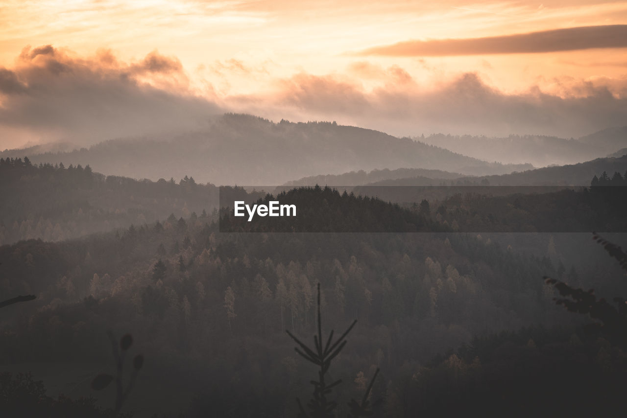 Scenic view of mountains against sky during sunset