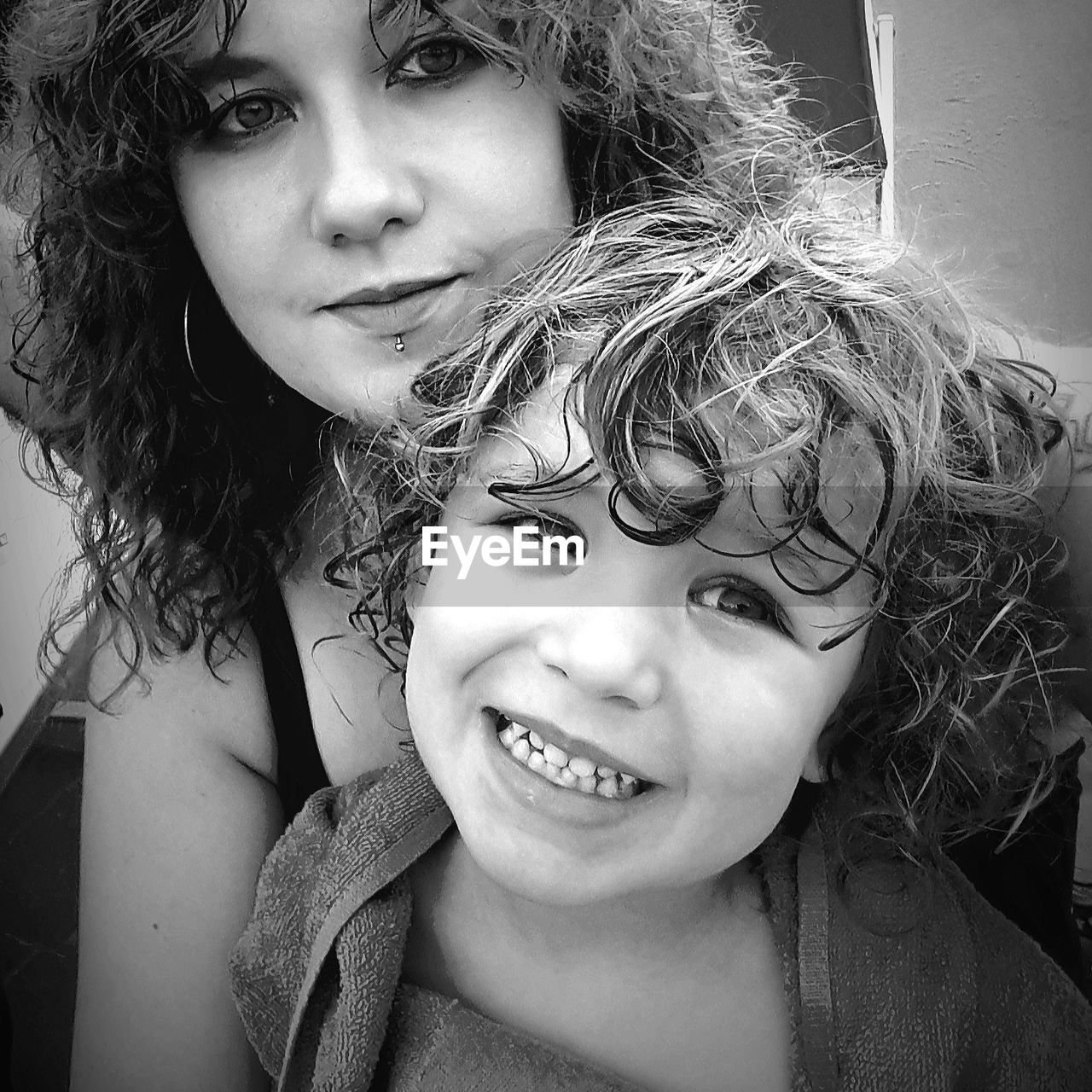 Portrait of mother and daughter at home