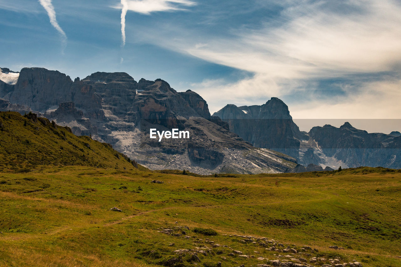 Scenic view of landscape and mountains against sky