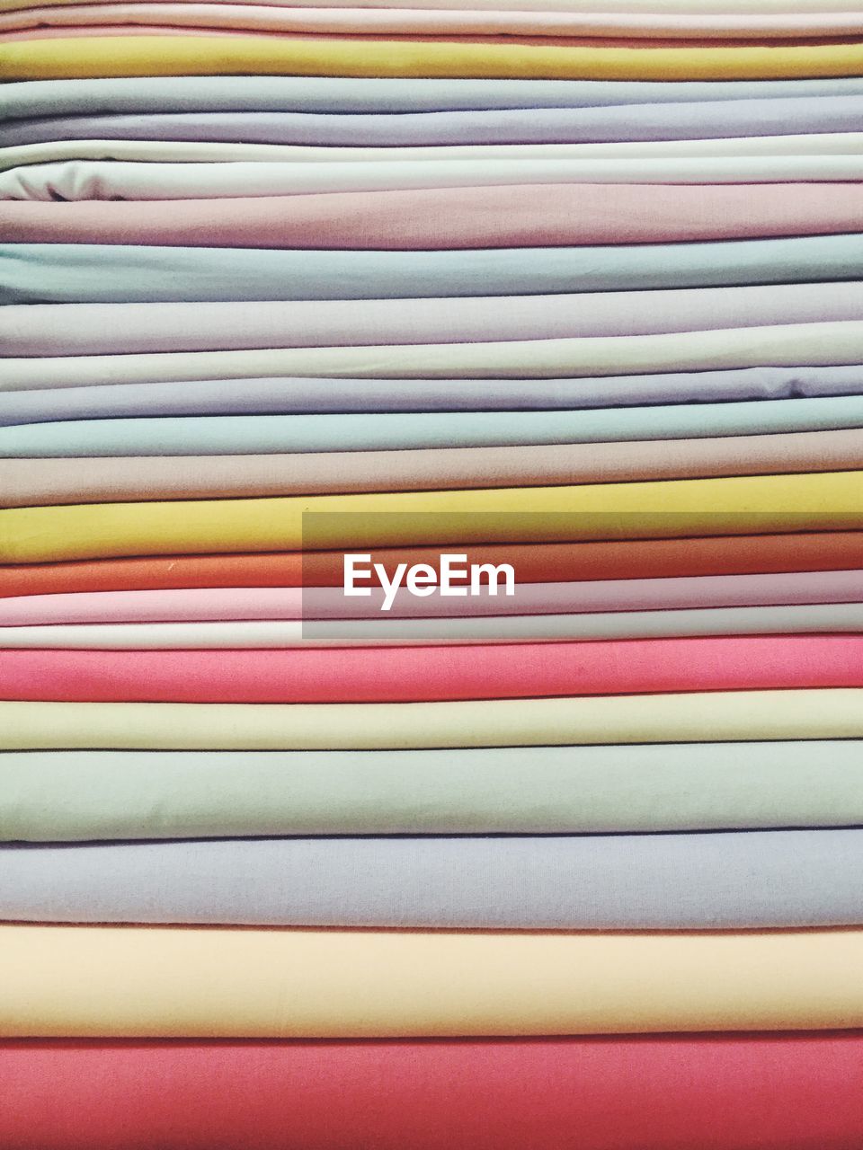 Full frame shot of multi colored stacked fabrics