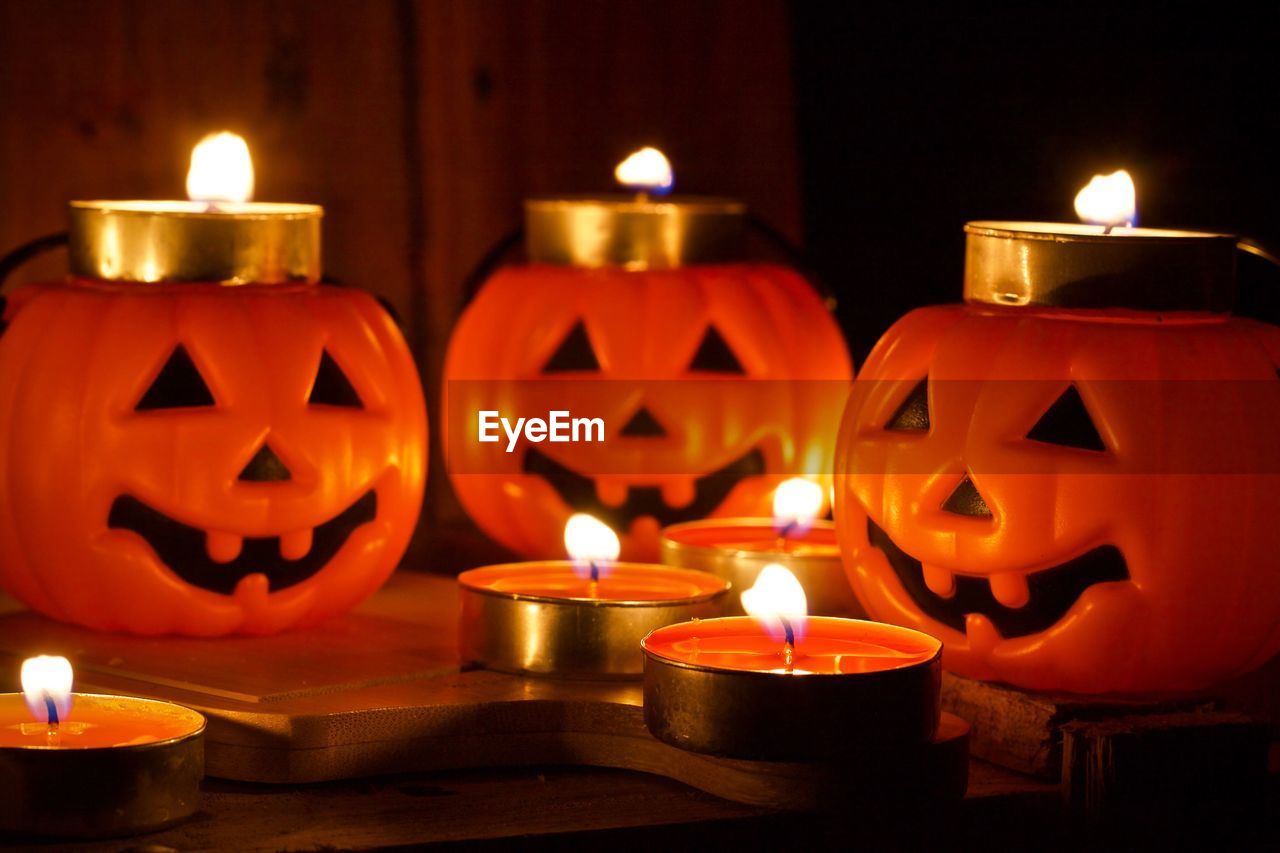 Close-up of illuminated tea light candles