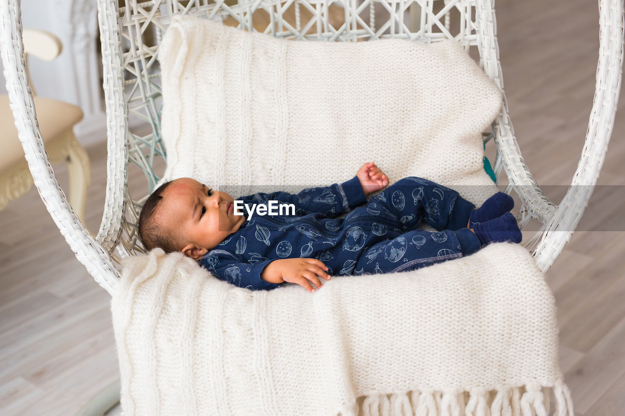 Cute boy sleeping on sofa