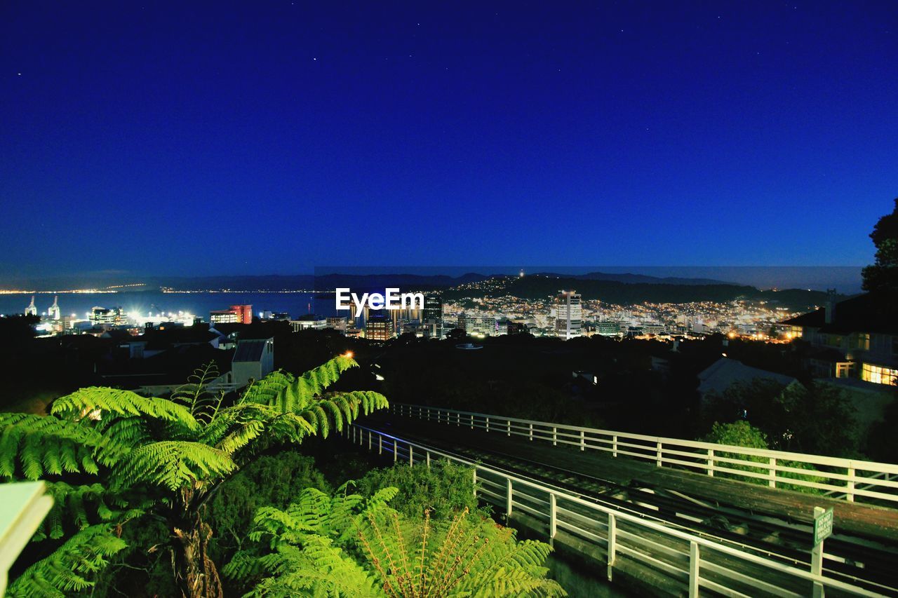 VIEW OF ILLUMINATED CITYSCAPE