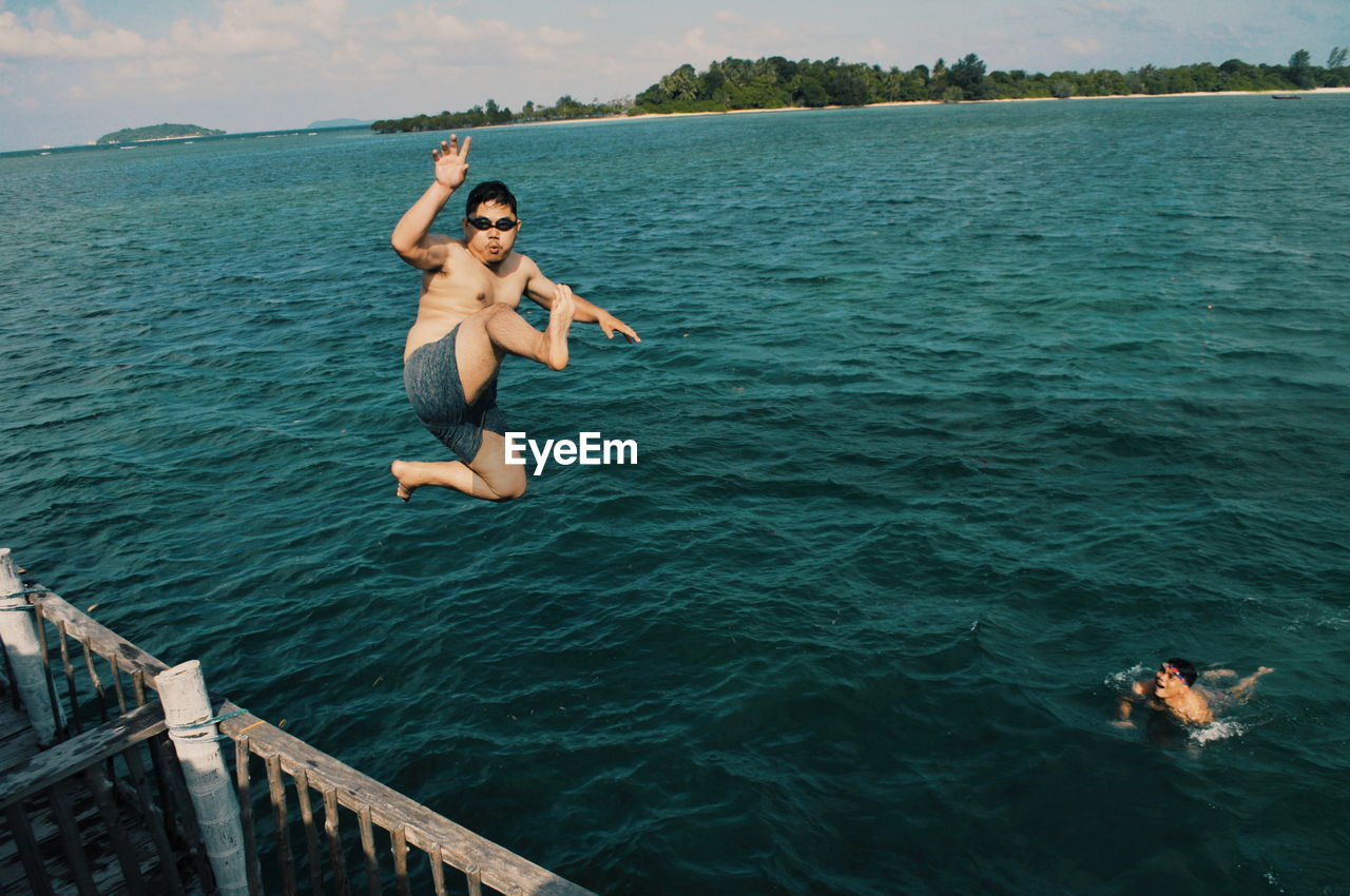 MAN JUMPING IN SEA