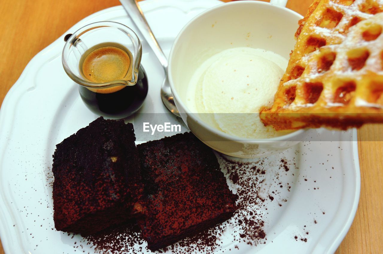 Coffee and sweets on plate