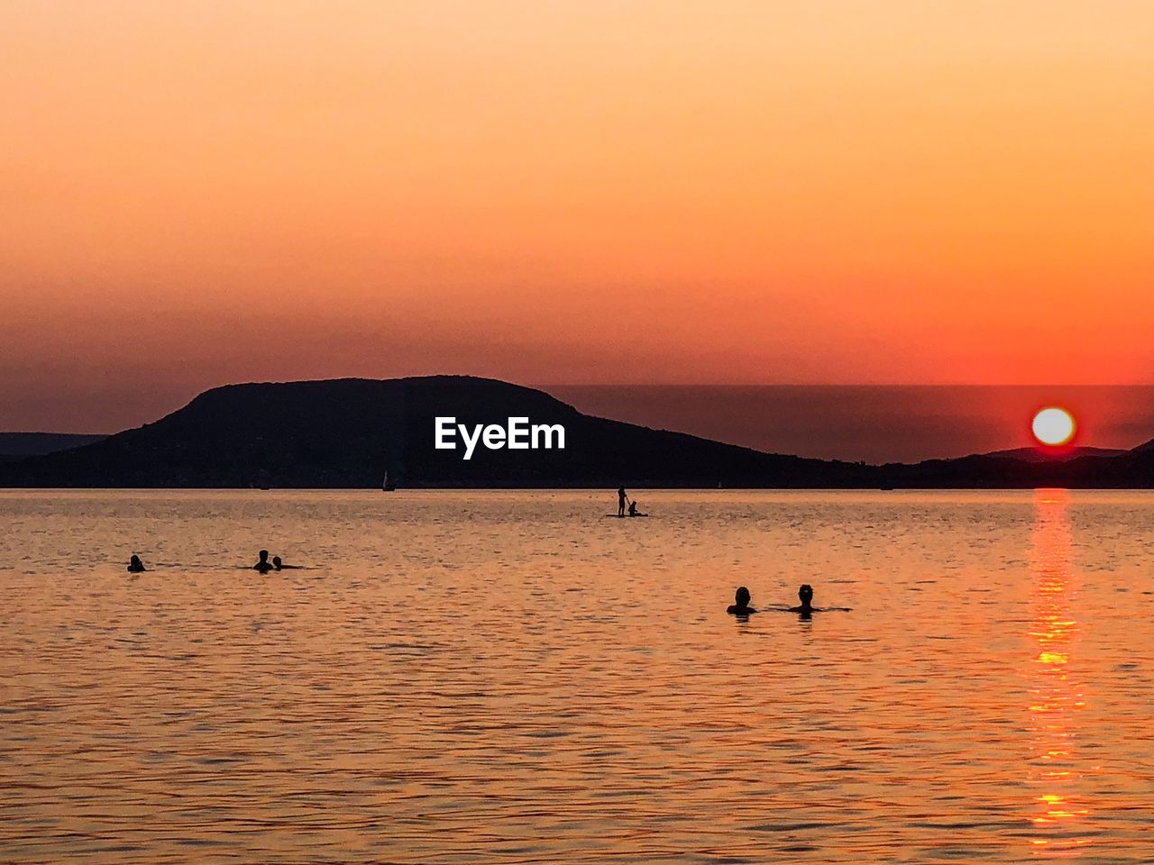 Scenic view of lake during sunset