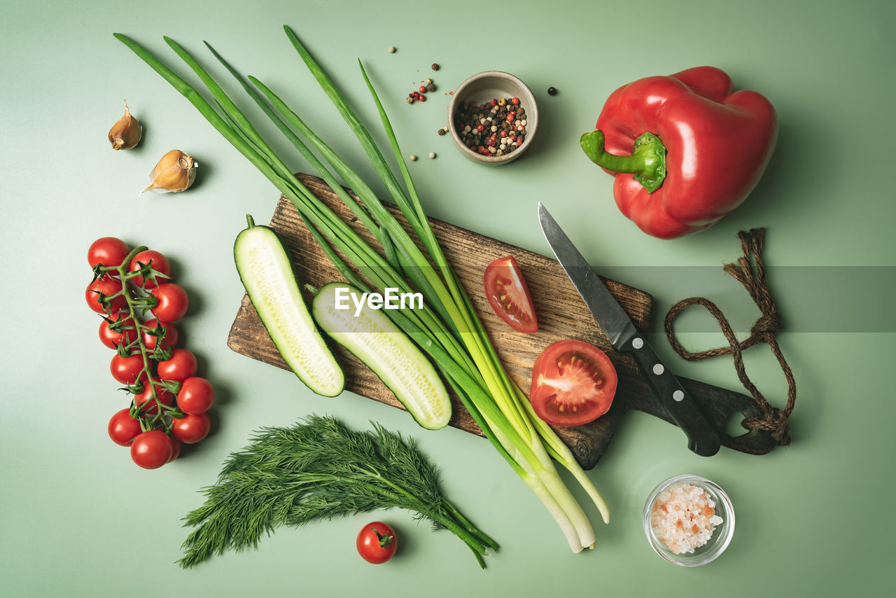 directly above shot of tomatoes and vegetables on table