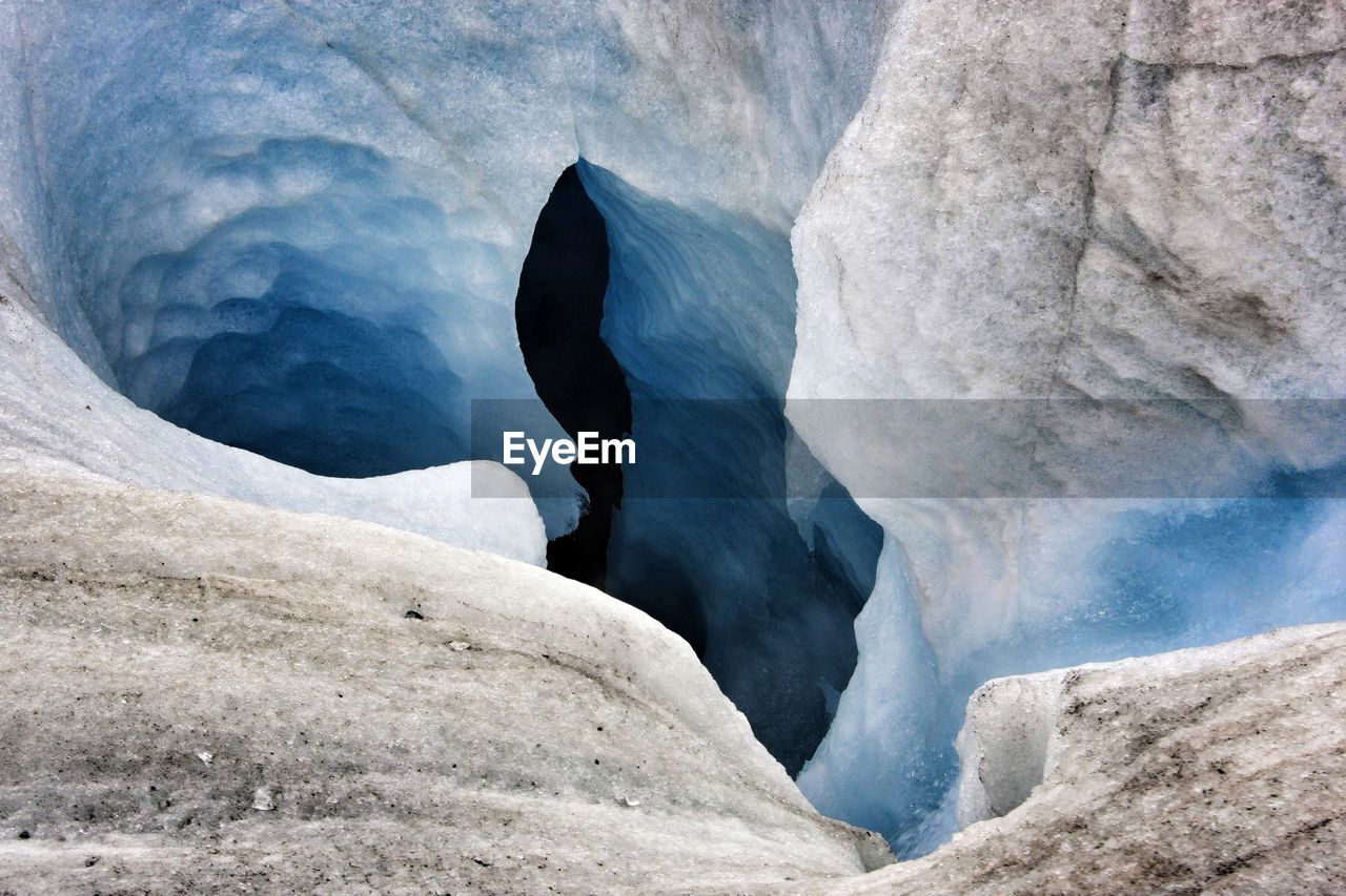 Rock formations in sea during winter