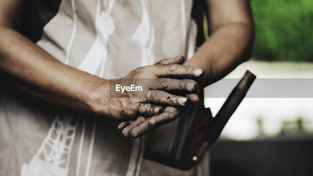 Hand of a man after take care of his garden.image of dirty hands .chill out time while gardening