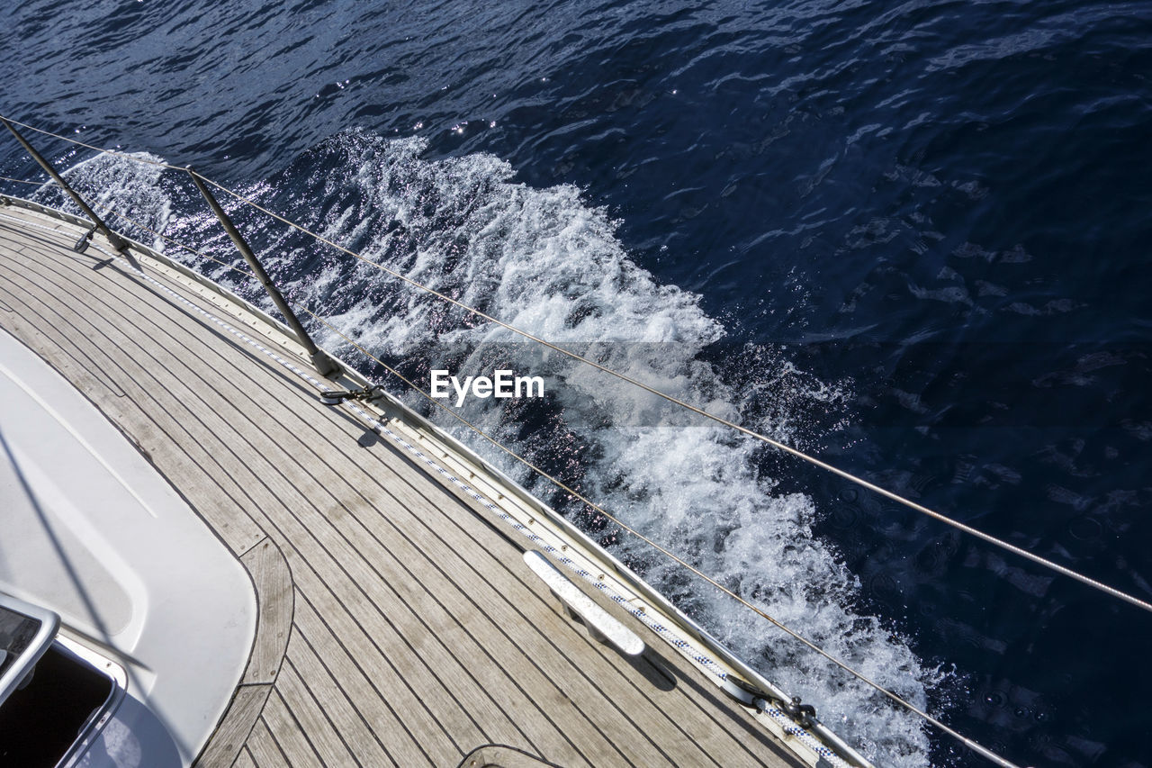 Cropped image of boat sailing in sea