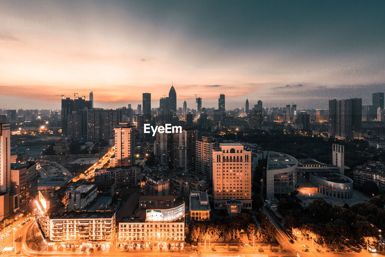 High angle view of city at sunset