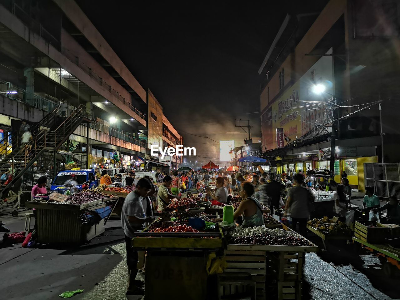 Group of people in market at night