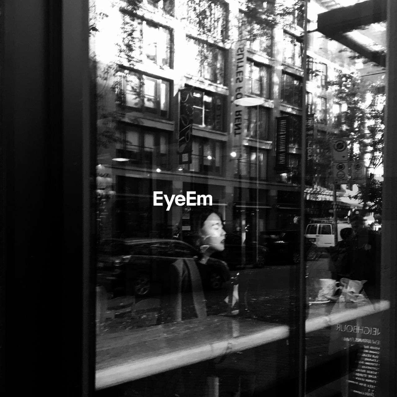 BLURRED MOTION OF MAN ON WET STREET